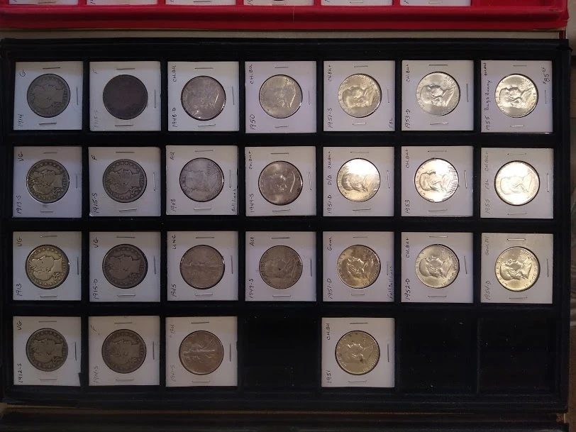 A display tray of silver dollars in coin flips at Monte's Coins & More