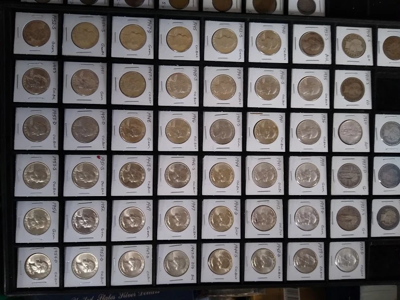 A full case of half dollars and dollars in coin flips