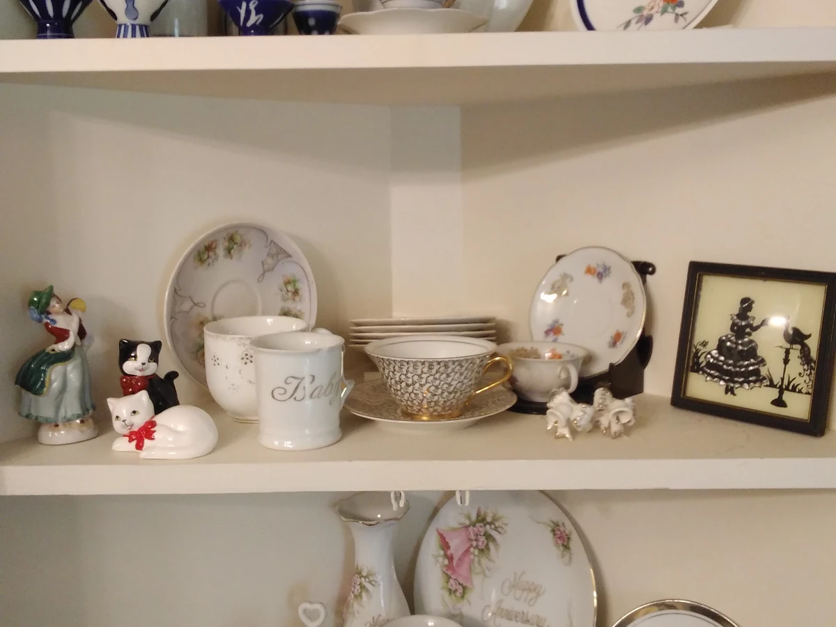 A shelf of antique china, porcelain and figurines at Monte's Coins & More